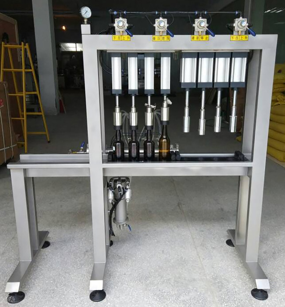 4-Head Manual Bottle Filling and Capping Machine